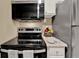 Close-up of kitchen featuring modern appliances and granite countertops at 1506 S Elliott St, Sanford, FL 32771