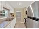 Efficient kitchen design with stainless steel appliances and granite countertops at 1506 S Elliott St, Sanford, FL 32771