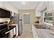 Functional kitchen with stainless steel appliances, granite countertops, and a view to the yard at 1506 S Elliott St, Sanford, FL 32771