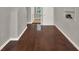 Living room featuring hardwood floors and an open doorway, creating a welcoming space at 1506 S Elliott St, Sanford, FL 32771