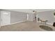 Spacious living room featuring tile floors and an arched doorway at 1506 S Elliott St, Sanford, FL 32771
