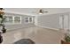Open living room with tile flooring, neutral walls, and a ceiling fan at 1506 S Elliott St, Sanford, FL 32771