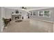 Bright living room featuring a fireplace, tile floors, and large windows at 1506 S Elliott St, Sanford, FL 32771