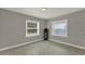 Living room with dual windows, neutral paint, and tiled floors throughout at 1506 S Elliott St, Sanford, FL 32771