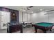 Spacious finished basement with games including a pool table, air hockey, and foosball table at 1614 Oak Hill Trl, Kissimmee, FL 34747