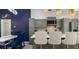 Bright eat-in kitchen with gray cabinets, white countertops, pendant lights, and stainless steel appliances at 1614 Oak Hill Trl, Kissimmee, FL 34747