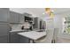 This kitchen features modern appliances, a breakfast bar, and ample cabinet space at 1614 Oak Hill Trl, Kissimmee, FL 34747