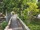 Backyard featuring a walkway between the property line and the foliage at 1797 Tillstream Dr, Orlando, FL 32818