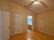 Main bedroom with a connecting bathroom and hardwood floors at 1797 Tillstream Dr, Orlando, FL 32818