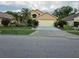 Charming single-story home featuring lush landscaping and a welcoming two-car garage at 1797 Tillstream Dr, Orlando, FL 32818