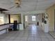 Large Florida room featuring tile floors, ceiling fan, and sliding doors leading to the backyard at 1797 Tillstream Dr, Orlando, FL 32818