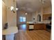 Bright kitchen with updated appliances, laminate floors, and an open layout to the living space at 1797 Tillstream Dr, Orlando, FL 32818