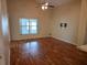 Cozy living room featuring hardwood floors and a window for natural light at 1797 Tillstream Dr, Orlando, FL 32818