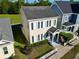 Inviting two-story home with lush landscaping, charming front porch and a manicured lawn at 183 Longview Ave, Kissimmee, FL 34747