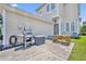 Outdoor patio featuring a grill and dining set, ideal for barbecues and outdoor gatherings at 183 Longview Ave, Kissimmee, FL 34747