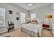 Cozy bedroom with a comfortable bed, natural light, and a classic turntable setup for a relaxed ambiance at 183 Longview Ave, Kissimmee, FL 34747