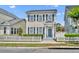 Charming two-story home featuring a white picket fence and an inviting covered front porch at 183 Longview Ave, Kissimmee, FL 34747