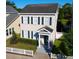 Charming two-story home with green shutters and a white picket fence, showcasing curb appeal at 183 Longview Ave, Kissimmee, FL 34747