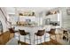 Kitchen with a large breakfast bar, modern appliances, and decor on top of the cabinets at 183 Longview Ave, Kissimmee, FL 34747