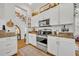 Bright kitchen with white cabinets, stainless appliances, and stylish decor at 183 Longview Ave, Kissimmee, FL 34747