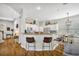 Bright and open kitchen with breakfast bar, sleek appliances, and adjacent dining area at 183 Longview Ave, Kissimmee, FL 34747