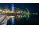 Scenic night view of Celebration, Florida reflected on a tranquil lake under illuminated streetlights at 183 Longview Ave, Kissimmee, FL 34747