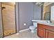 Modern bathroom featuring tile shower, sleek vanity, and neutral color scheme at 204 Quail Trail Ct, Lake Mary, FL 32746