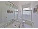 Bright bathroom featuring a white vanity, granite countertop, and a glass-enclosed shower at 204 Quail Trail Ct, Lake Mary, FL 32746