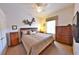 Cozy bedroom with comfortable bedding, matching nightstands and dressers, and a ceiling fan at 204 Quail Trail Ct, Lake Mary, FL 32746
