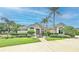 Stunning single-story home with meticulously landscaped front yard, fountain, and palm trees at 204 Quail Trail Ct, Lake Mary, FL 32746