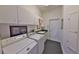 A functional laundry room featuring ample cabinet space and modern washer and dryer at 204 Quail Trail Ct, Lake Mary, FL 32746