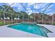 Screened-in pool area with refreshing turquoise water and mature backyard landscaping at 204 Quail Trail Ct, Lake Mary, FL 32746