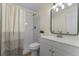 Clean bathroom with a shower featuring white tile and a vanity with a modern sink and mirror at 235 Ruth Blvd, Longwood, FL 32750