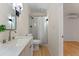 Bathroom showcasing modern fixtures, including a shower with a curtain, and a sink at 235 Ruth Blvd, Longwood, FL 32750