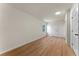 This bedroom features wood floors, a window, and fresh, neutral paint at 235 Ruth Blvd, Longwood, FL 32750