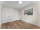 Bedroom featuring wood floors, neutral walls, and one window for natural light at 235 Ruth Blvd, Longwood, FL 32750