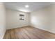 Bedroom featuring wood floors, neutral walls, and one window for natural light at 235 Ruth Blvd, Longwood, FL 32750