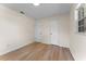 Bedroom featuring wood floors, neutral walls, and two doors for convenience at 235 Ruth Blvd, Longwood, FL 32750