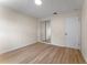 Bedroom featuring wood floors, neutral walls, and closet with mirrored sliding doors at 235 Ruth Blvd, Longwood, FL 32750