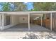 The parking area is located next to the house and has a well-maintained concrete floor and a fenced yard at 235 Ruth Blvd, Longwood, FL 32750