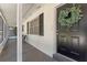 Inviting front porch with seating area, providing a relaxing outdoor space at 235 Ruth Blvd, Longwood, FL 32750