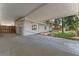 Covered parking area, featuring a detached garage, a well-maintained concrete floor and a fenced yard at 235 Ruth Blvd, Longwood, FL 32750