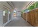 Covered parking area with a detached garage and a fenced yard. The area has a concrete floor at 235 Ruth Blvd, Longwood, FL 32750