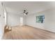 Living room with light wood flooring, window and stairs to a kitchen at 235 Ruth Blvd, Longwood, FL 32750