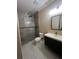 Modern bathroom features a tiled shower, updated vanity, a toilet, and neutral color walls at 2420 Graham Dr, Orlando, FL 32807