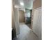 Modern bathroom features a tiled walk-in shower with glass door and pebble floor at 2420 Graham Dr, Orlando, FL 32807