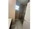 Modern bathroom features a tiled shower, updated vanity, a toilet, and neutral color walls at 2420 Graham Dr, Orlando, FL 32807