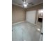 Bedroom with closet and bath featuring a ceiling fan, large closet, and stylish marble floors at 2420 Graham Dr, Orlando, FL 32807