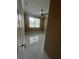 This bedroom has a ceiling fan, a window, and marble floors at 2420 Graham Dr, Orlando, FL 32807