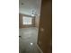 This bedroom has a ceiling fan, a window, and marble floors at 2420 Graham Dr, Orlando, FL 32807